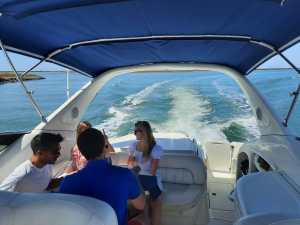 a group of people in a boat on a body of water