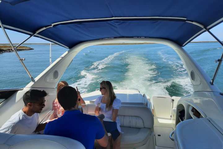 a group of people in a boat on a body of water