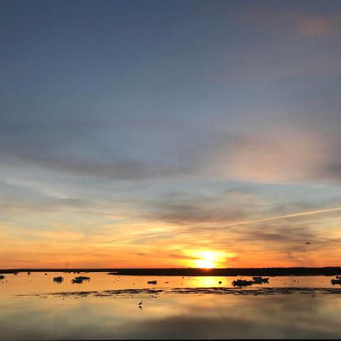 a sunset over a body of water