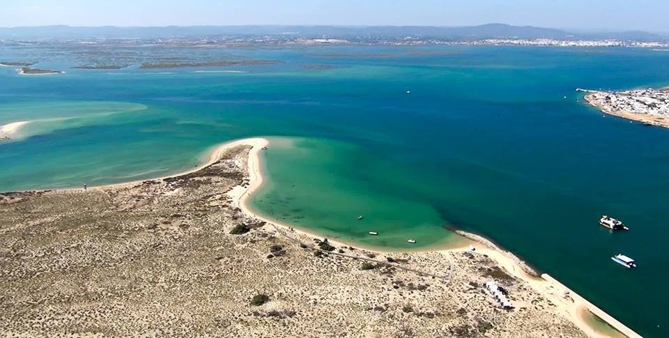 a view of a beach next to a body of water