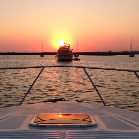 a boat is docked next to a body of water