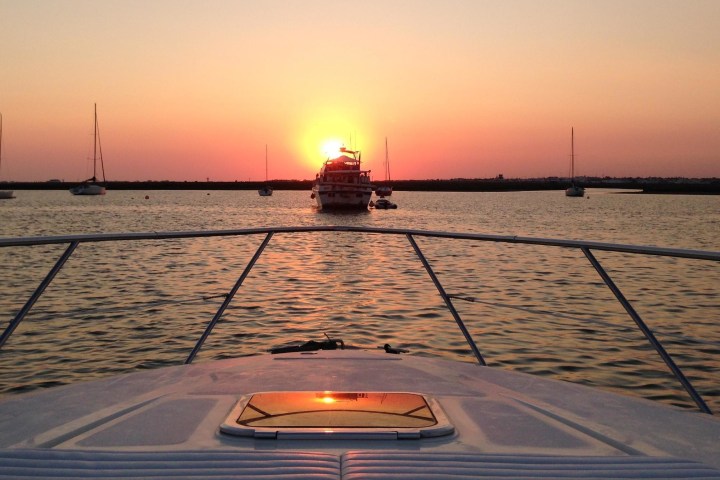 a boat is docked next to a body of water