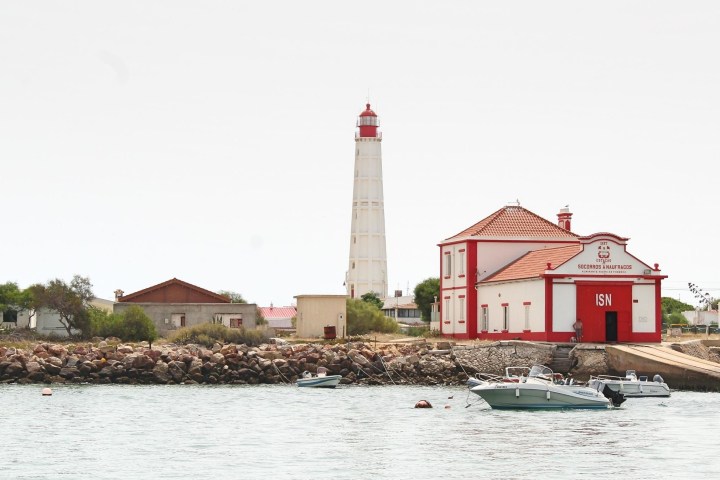 a house next to a body of water