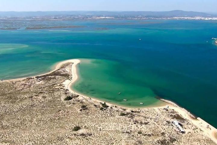 a view of a beach next to a body of water