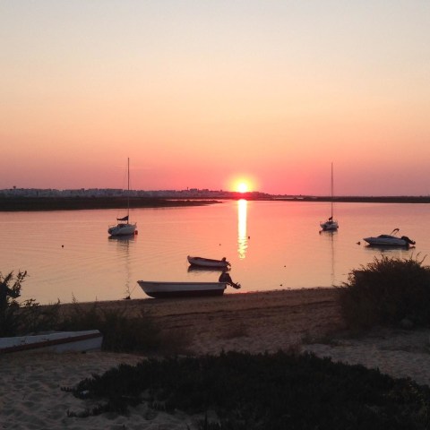 a sunset over a body of water