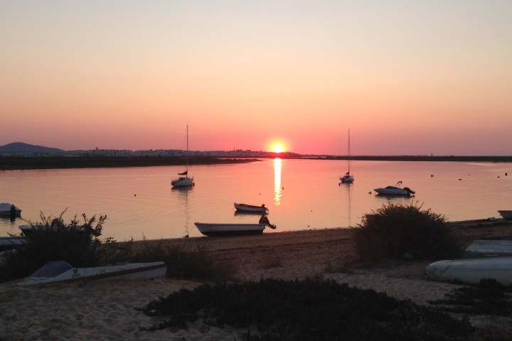 a sunset over a body of water