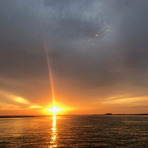 a sunset over a body of water