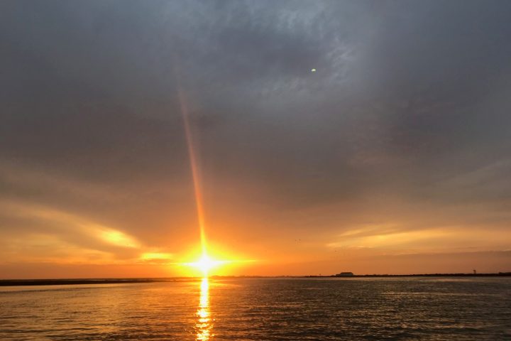 a sunset over a body of water