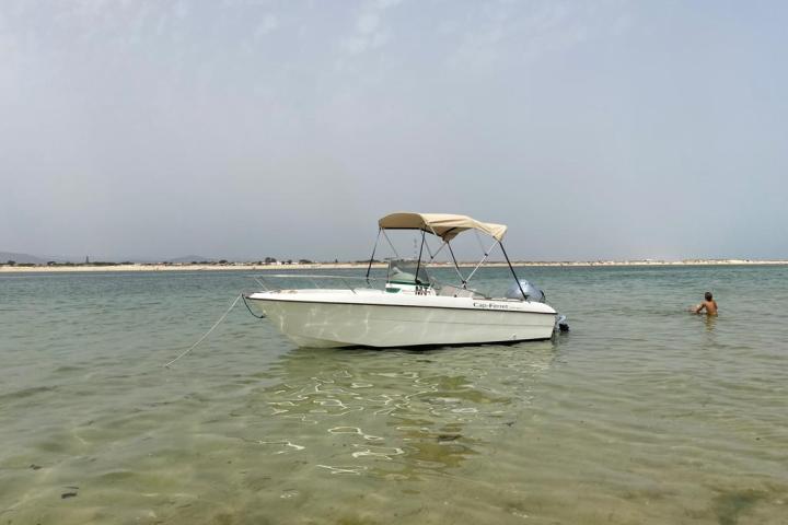 a small boat in a body of water