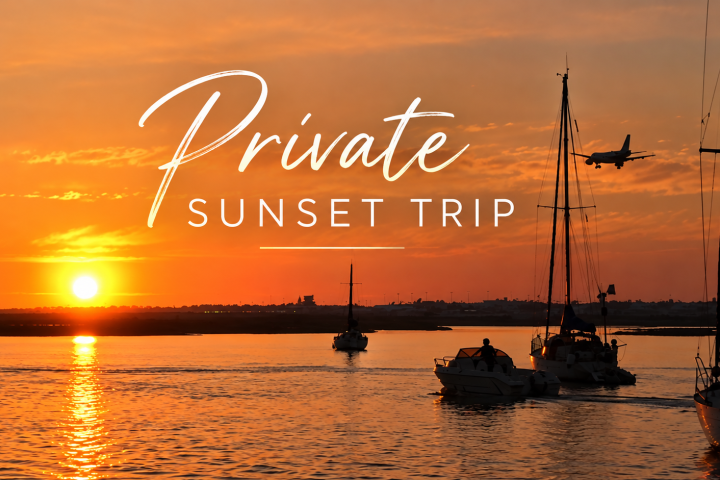 Sailboats and plane at sunset
