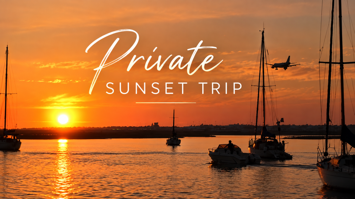 Sailboats and plane at sunset